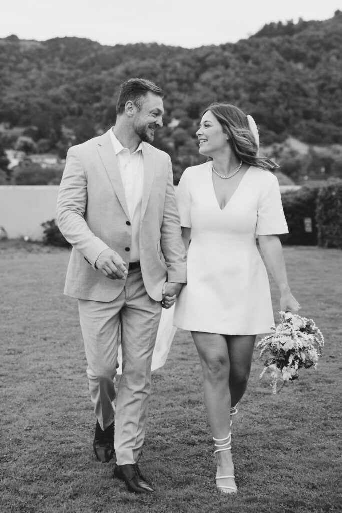 Newlyweds walking and laughing after Marin Civic Center elopement ceremony, Rose Freedman Photography
